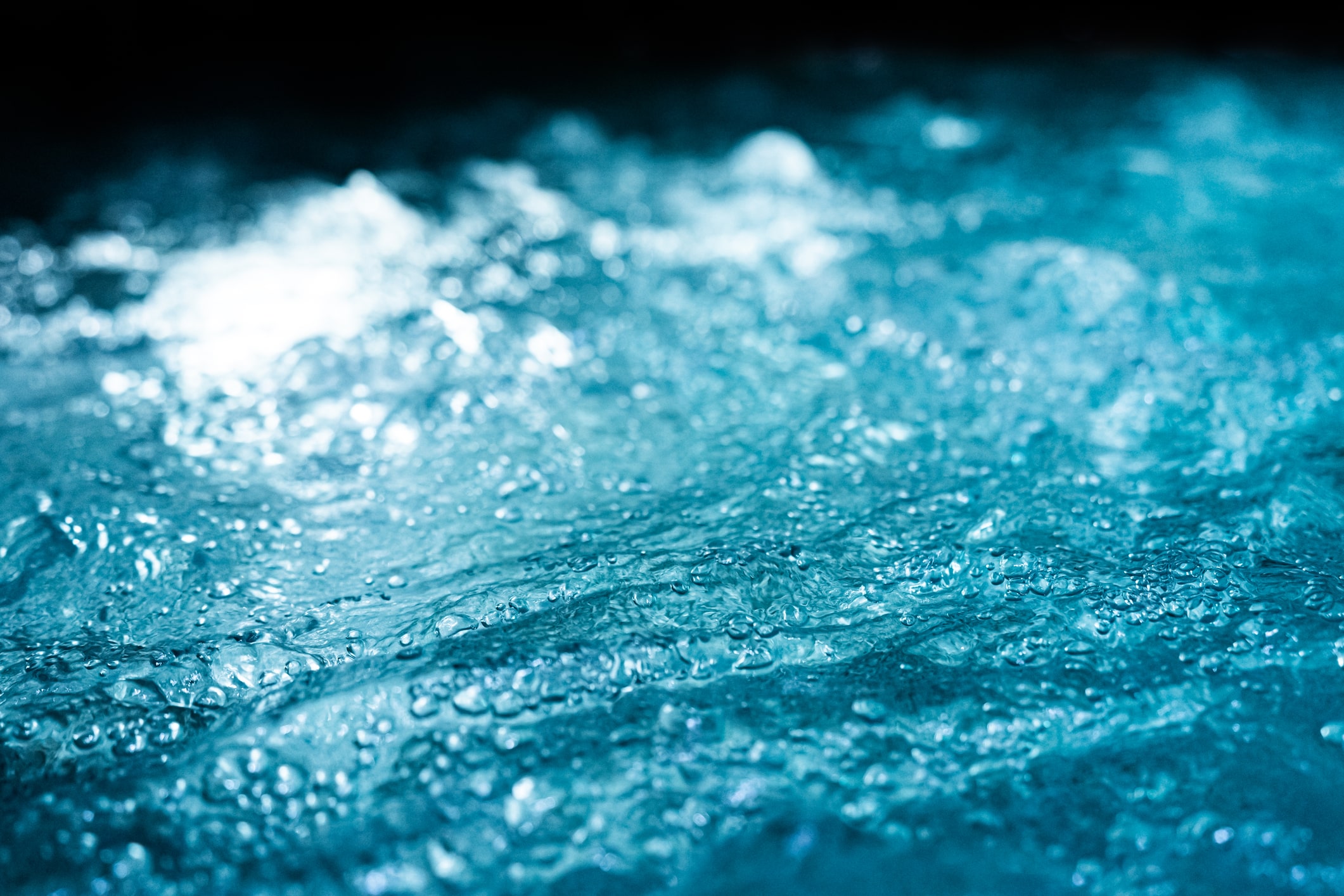 swirling blue waters of an ice bath used for cold water therapy