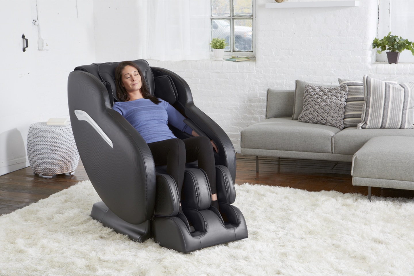 women enjoys her massage chair in the comfort of her home